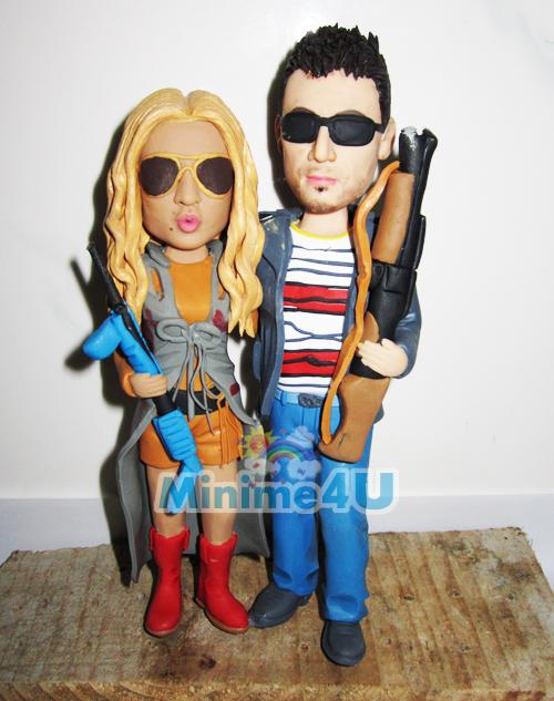 couple with shotguns cake topper
