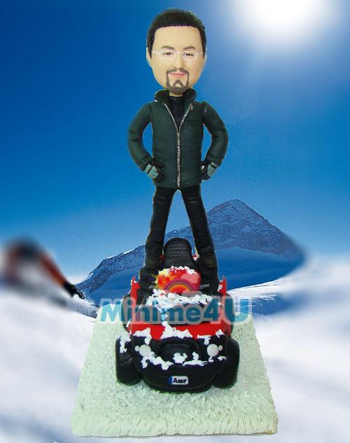 Snowmobile driver figurine