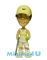 Playing tennis style mini me doll